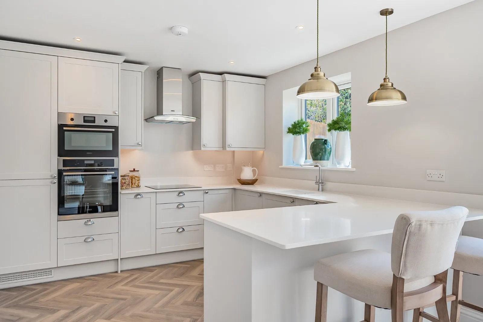 a kitchen with a center island and a stove top oven