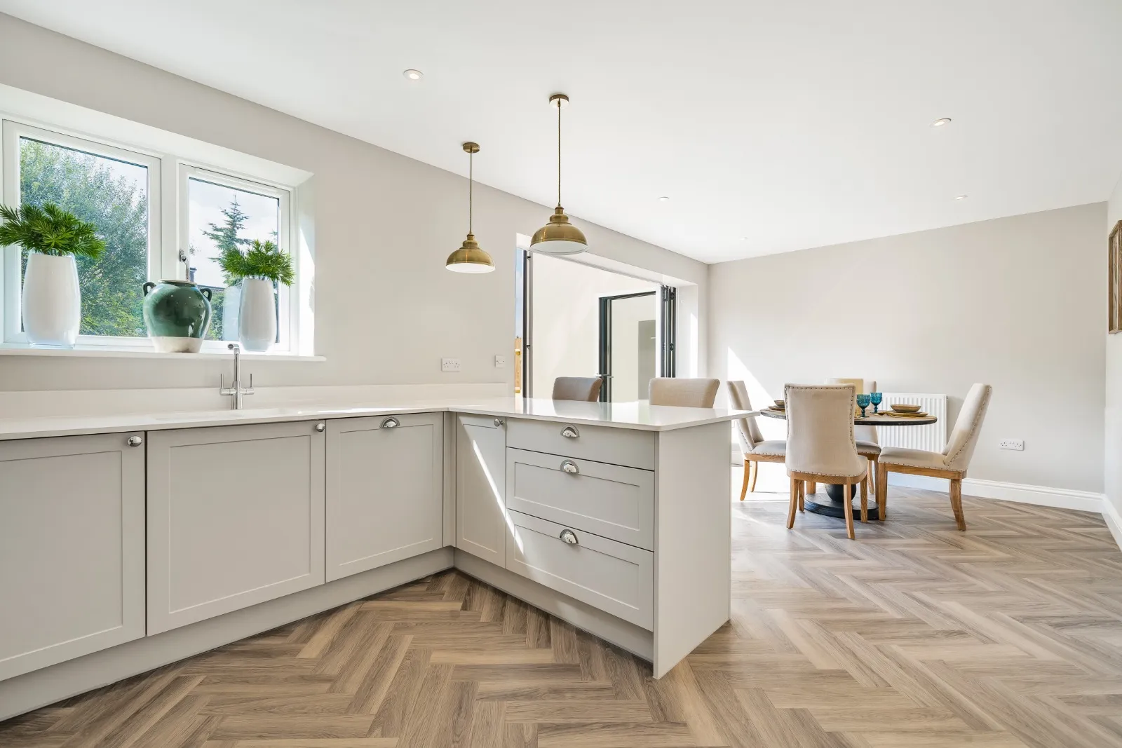 a large kitchen with a center island in the middle of the room