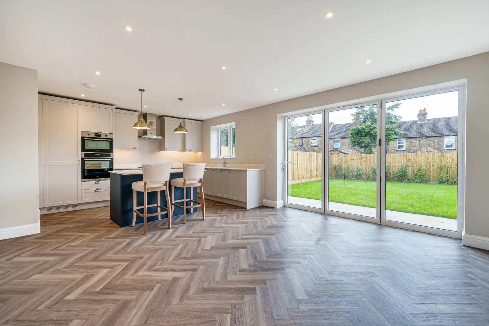 a kitchen and dining room with a large sliding glass door